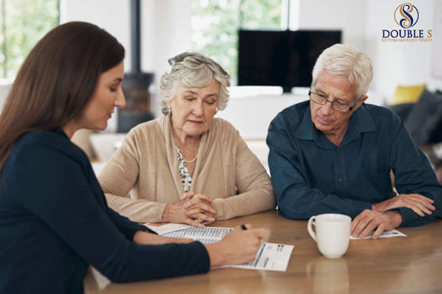 Family meeting with advisor reviewing estate documents together