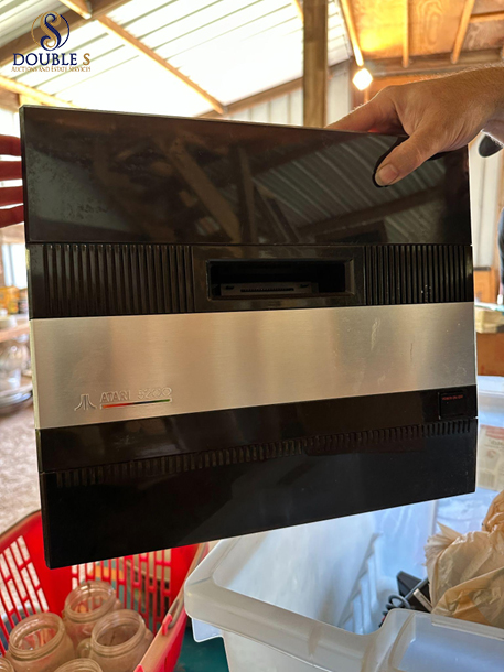 Vintage household items sorted during an estate sale preparation process